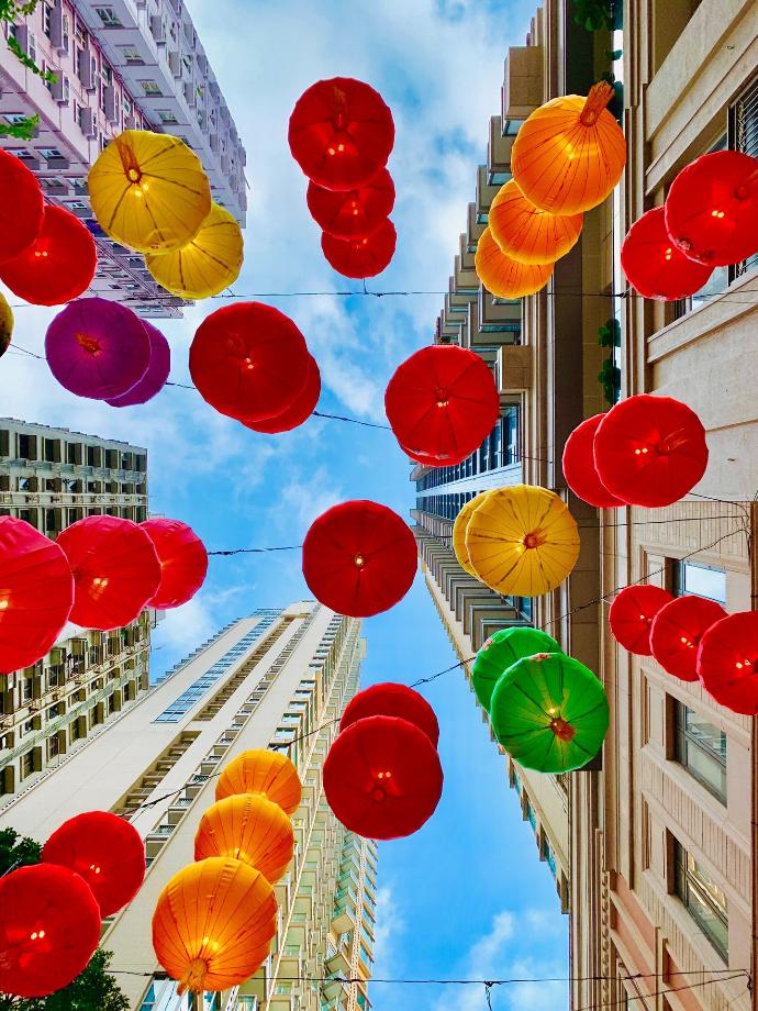 assorted color umbrellas near building